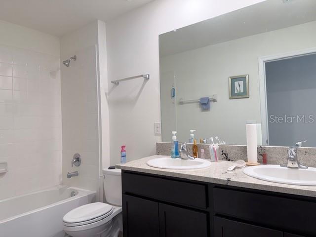 5175 Southwest 47th Lane Gainesville, FL 32608 - Photo 19 of 24 a bathroom with a sink a toilet and shower