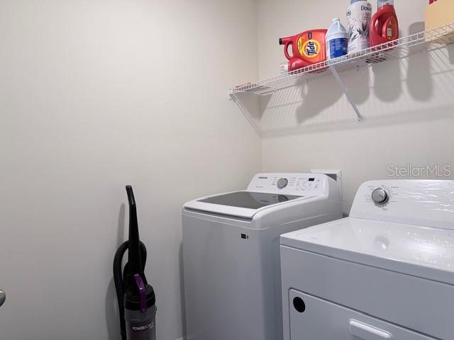5175 Southwest 47th Lane Gainesville, FL 32608 - Photo 22 of 24 a utility room with dryer and washer