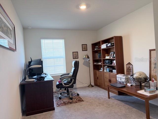 5175 Southwest 47th Lane Gainesville, FL 32608 - Photo 24 of 24 a view of a workspace with furniture and a window