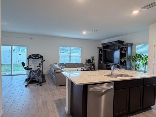 5175 Southwest 47th Lane Gainesville, FL 32608 - Photo 5 of 24 a room with a sink wooden floor and furniture