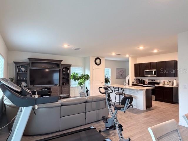5175 Southwest 47th Lane Gainesville, FL 32608 - Photo 8 of 24 a living room with furniture and a flat screen tv