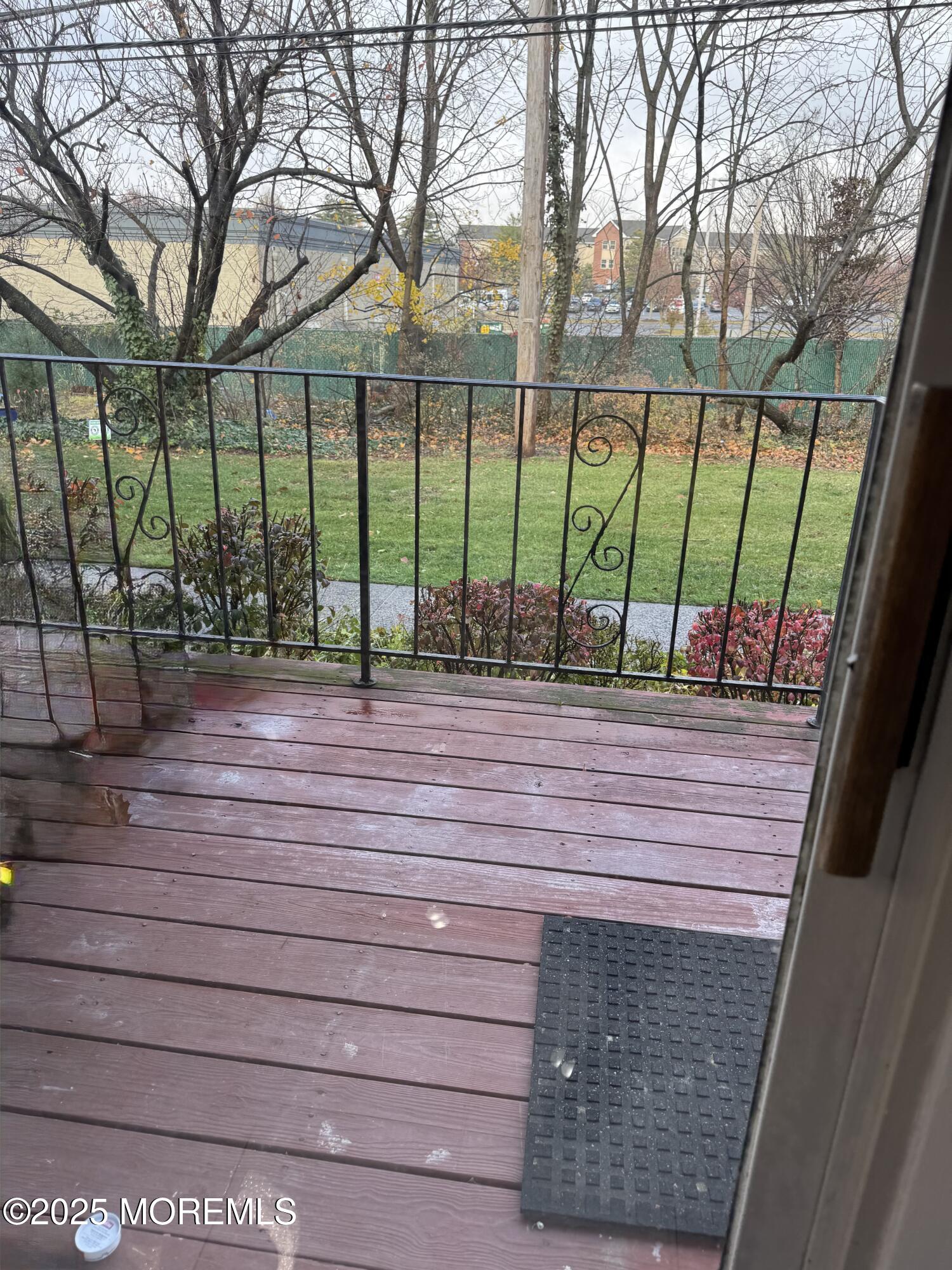 a view of sitting area with trees in a backyard