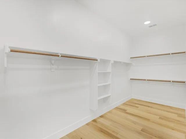 a view of a bathroom with a sink and mirror