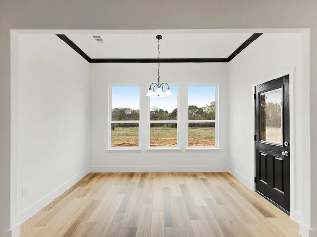 a bathroom with a double vanity sink mirror and shower