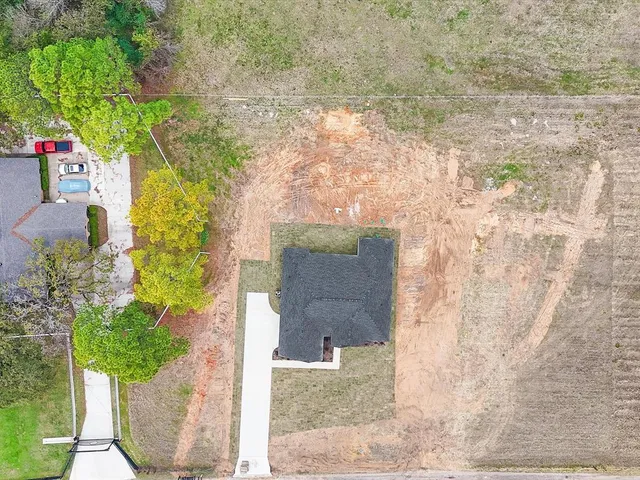 an aerial view of residential house with outdoor space