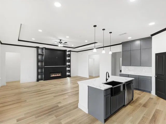 an aerial view of a house with yard