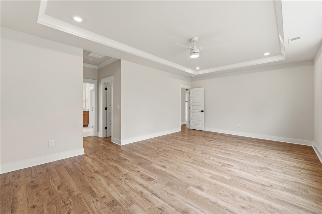 319 Summerall Drive Anderson, SC 29621 - Photo 16 of 37 This spacious room offers comfortable living with elegant tray ceilings and rich wood flooring.