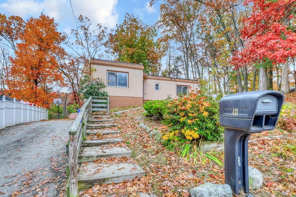 40 Truman Circle Springfield, MA 01109 - Photo 2 of 13 a front view of a house with garden
