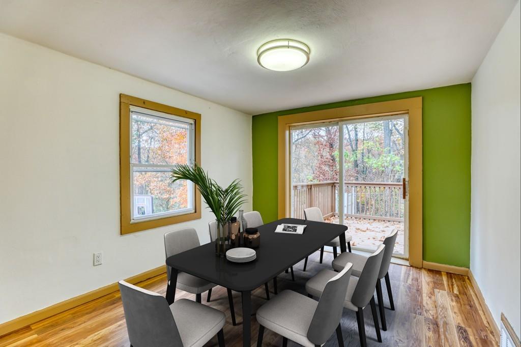 40 Truman Circle Springfield, MA 01109 - Photo 6 of 13 a view of a dining room with furniture and a potted plant