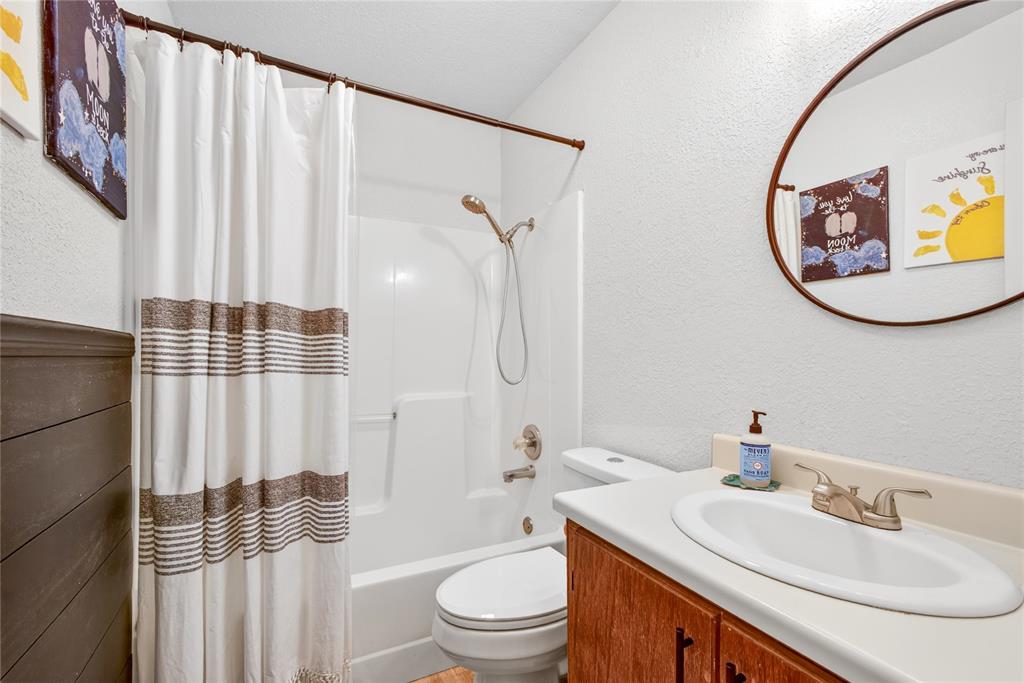 703 College Street Celeste, TX 75423 - Photo 20 of 29 a bathroom with a sink toilet and shower