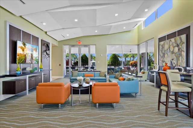 a living room filled with furniture and a flat screen tv