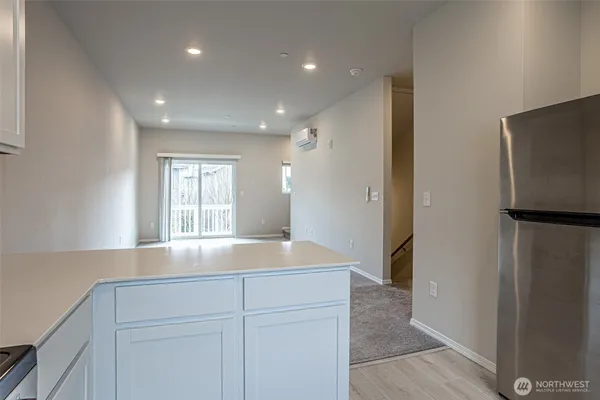 a kitchen with stainless steel appliances a refrigerator and a sink