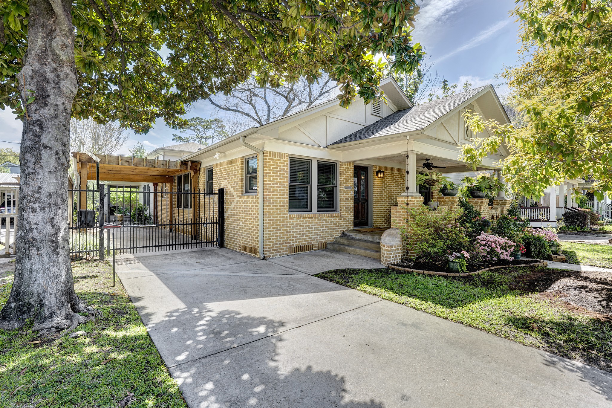 1314 Harvard Street Houston, TX 77008 - Photo 36 of 36 a front view of a house with a yard and potted plants