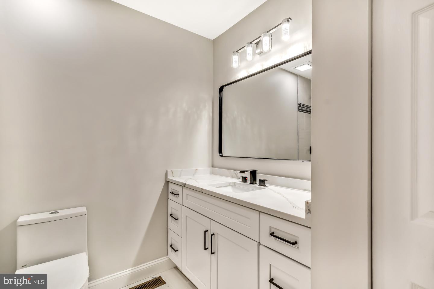 24 Mill Court Pine Hill, NJ 08021 - Photo 11 of 19 a bathroom with a sink and a mirror