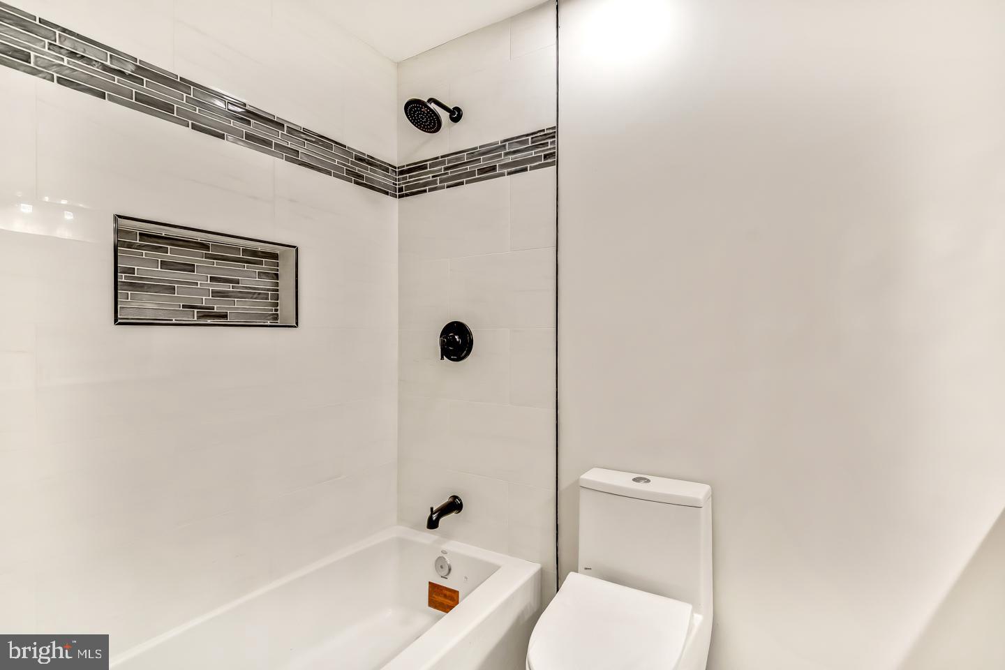 24 Mill Court Pine Hill, NJ 08021 - Photo 12 of 19 a bathroom with a tub a toilet and a shower
