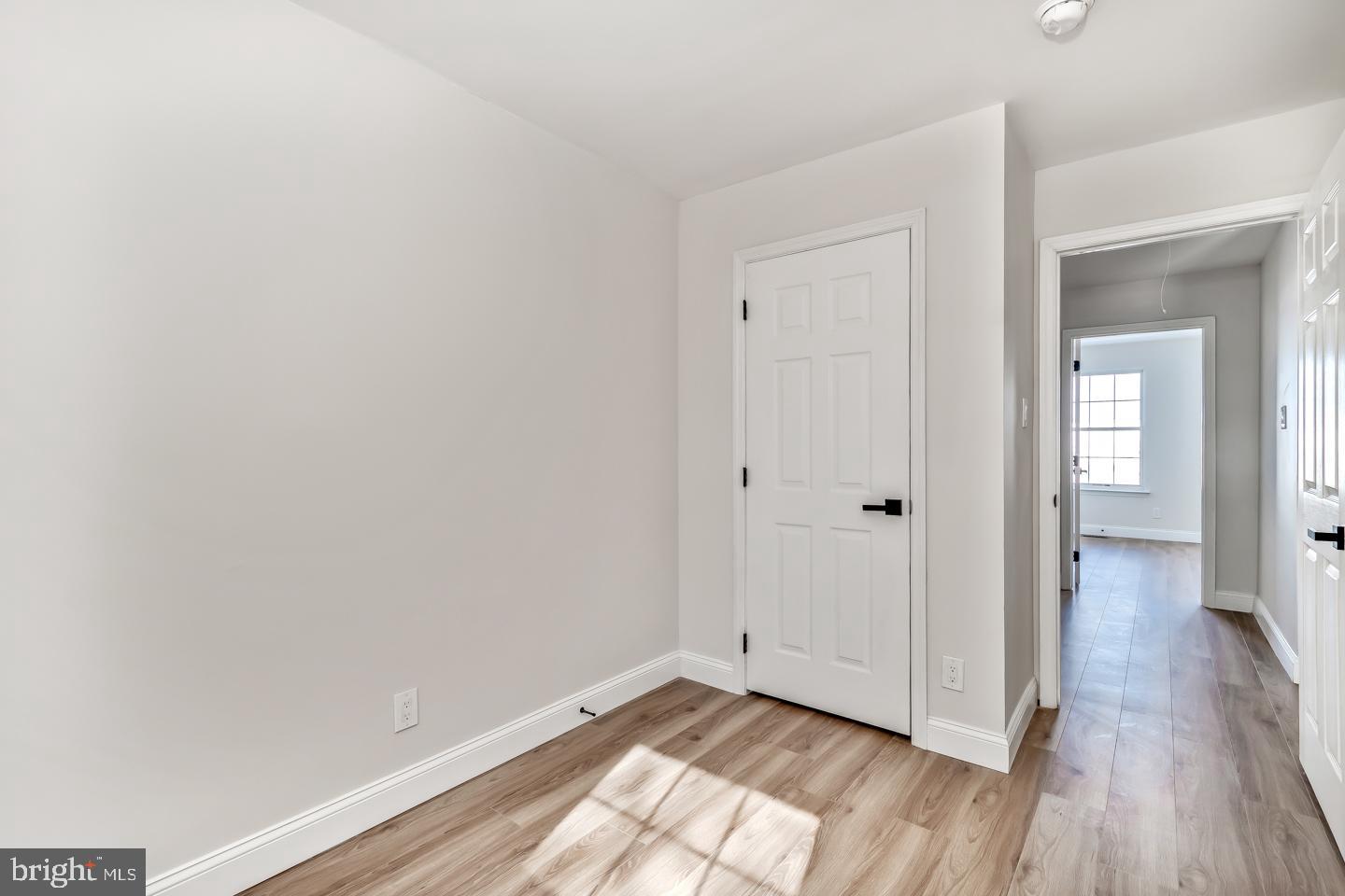 24 Mill Court Pine Hill, NJ 08021 - Photo 14 of 19 a view of an empty room and wooden floor