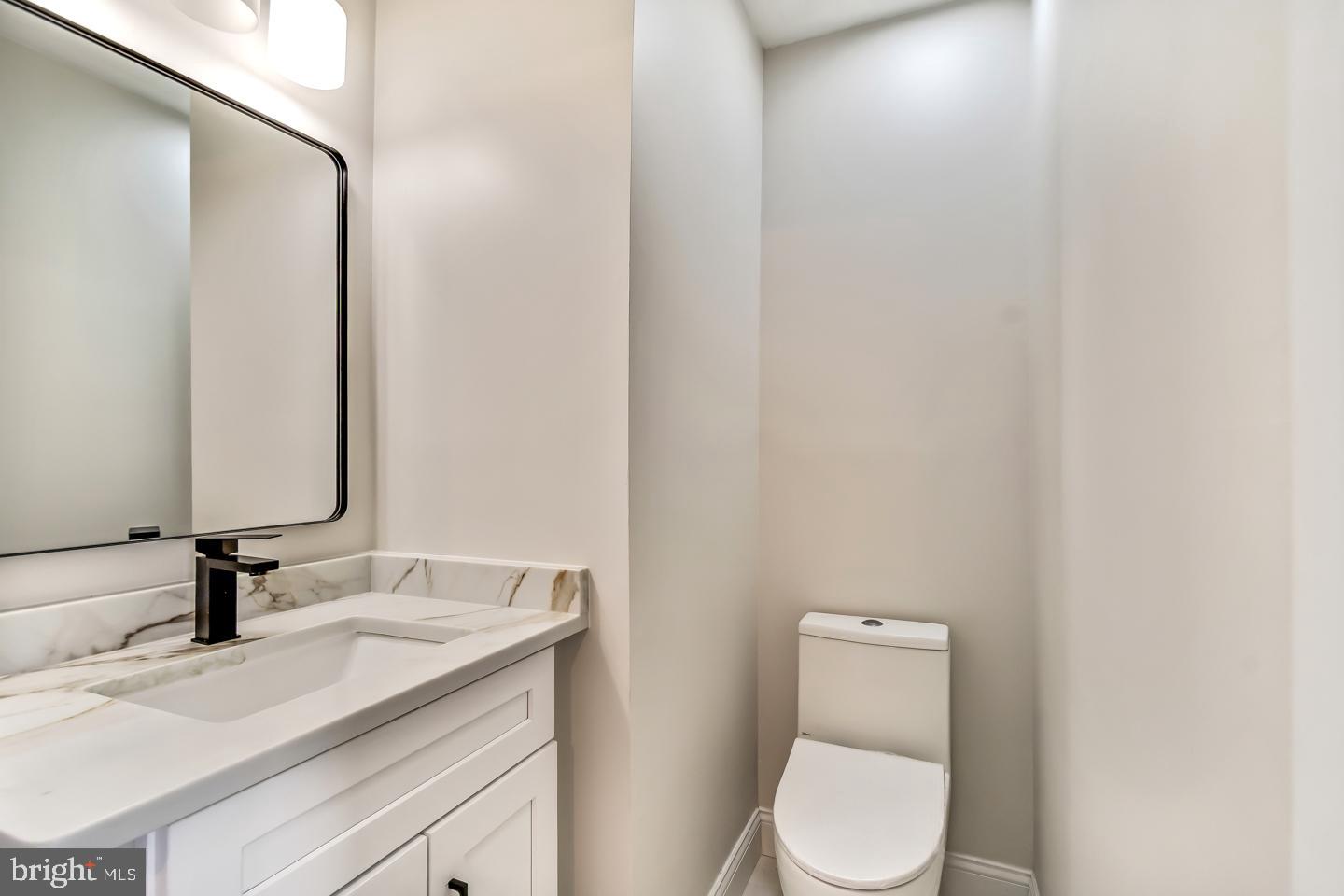 24 Mill Court Pine Hill, NJ 08021 - Photo 7 of 19 a bathroom with a granite countertop toilet sink and mirror