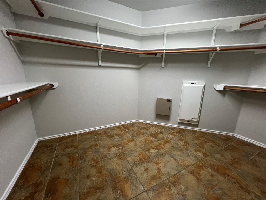 9301 Muskberry Cove Austin, TX 78717 - Photo 14 of 23 a view of a room with shelf