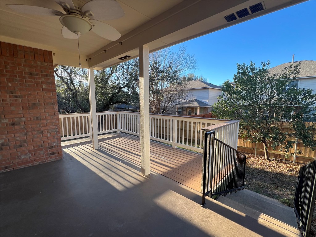 9301 Muskberry Cove Austin, TX 78717 - Photo 20 of 23 a view of a porch with wooden floor and iron fence
