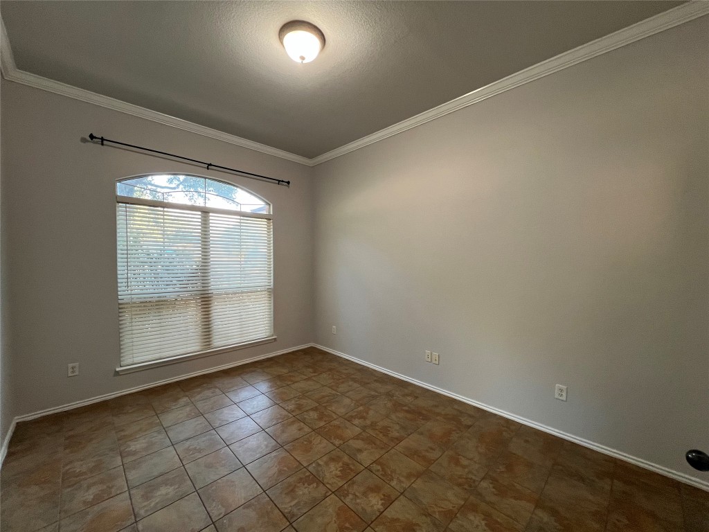 9301 Muskberry Cove Austin, TX 78717 - Photo 4 of 23 an empty room with large windows