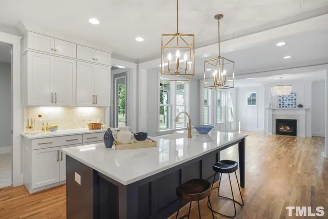 a kitchen with sink cabinets and wooden floor