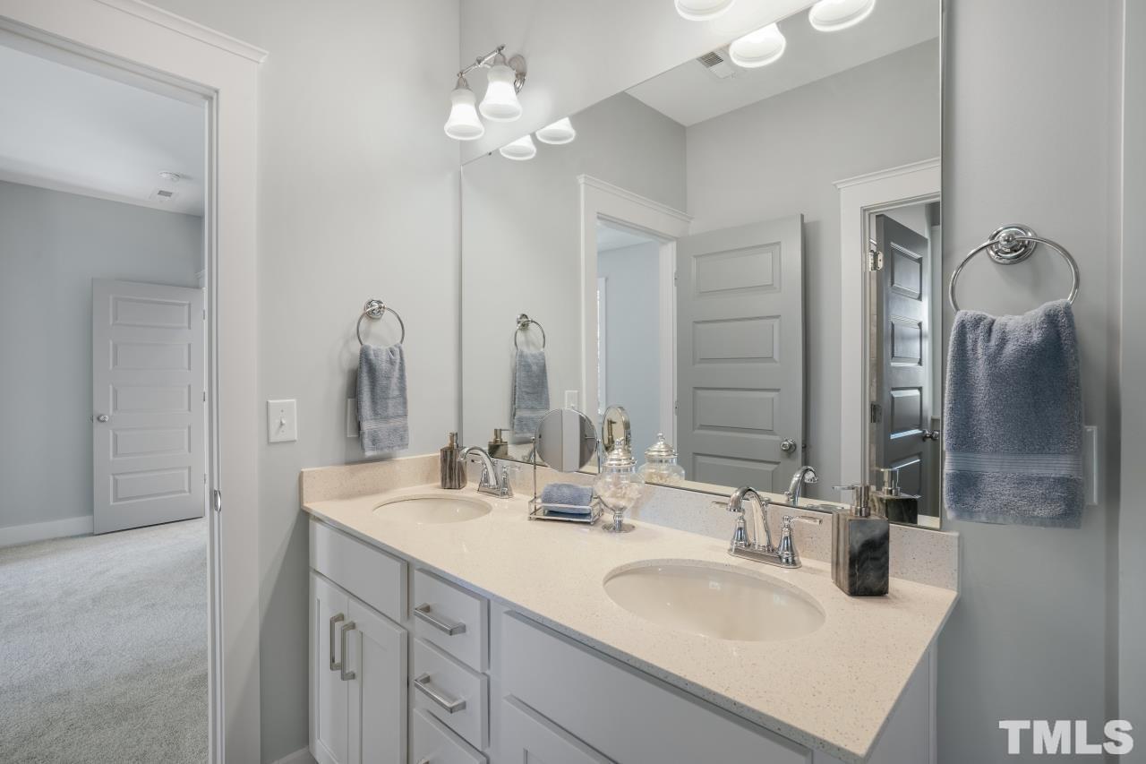 1017 Terrabella Way Durham, NC 27713 - Photo 5 of 8 a bathroom with a sink double vanity and a mirror