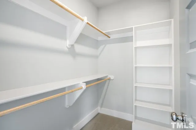 a view of an empty walk in closet