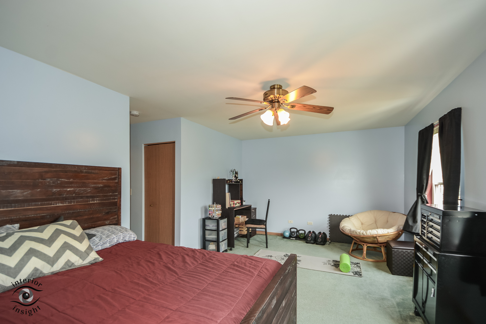 25216 Faraday Road Manhattan, IL 60442 - Photo 14 of 23 a bedroom with a bed and a chandelier