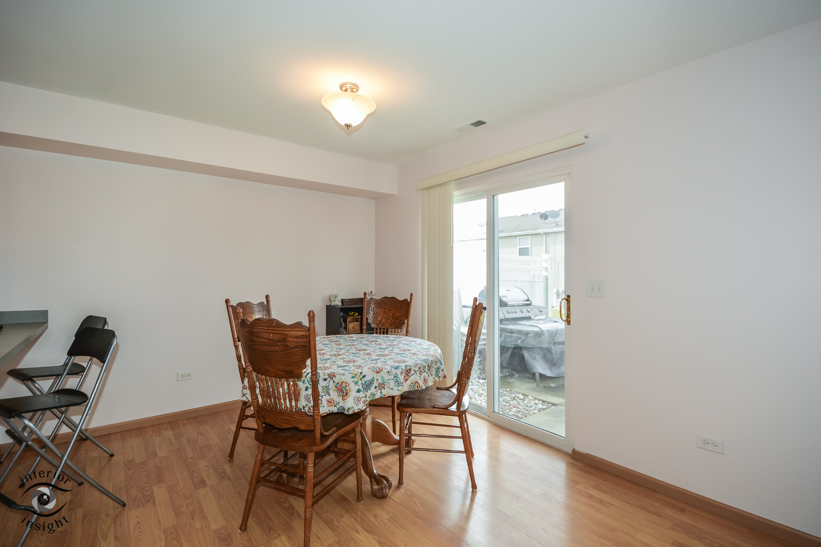 25216 Faraday Road Manhattan, IL 60442 - Photo 8 of 23 a view of a dining room with furniture and wooden floor