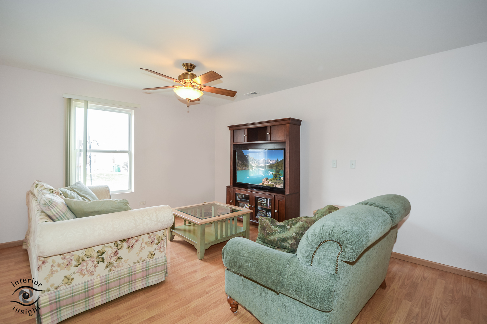 25216 Faraday Road Manhattan, IL 60442 - Photo 10 of 23 a living room with furniture and a flat screen tv