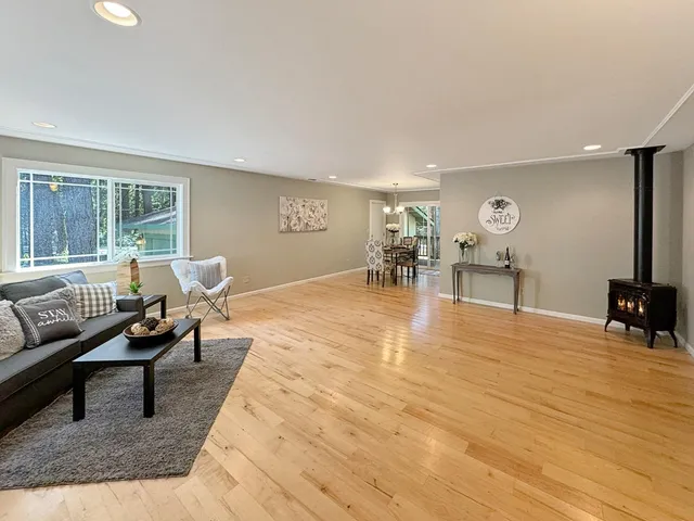 a living room with furniture and a table