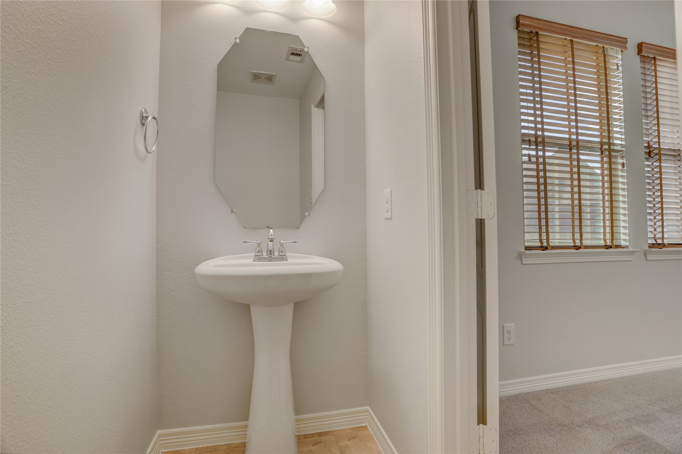 3002 Currant Drive Manvel, TX 77578 - Photo 31 of 43 a bathroom with a sink and a mirror