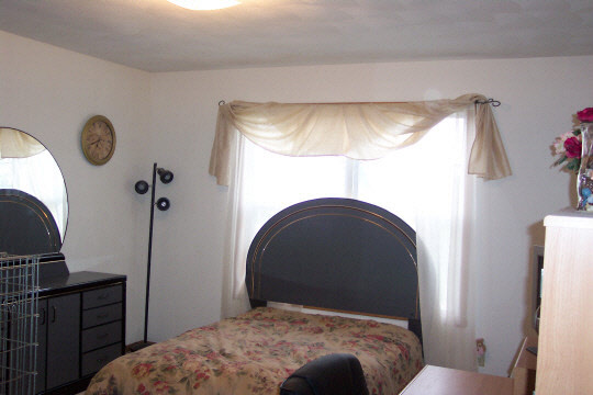 766 Bayfield Road Rockton, IL 61072 - Photo 5 of 6 a bedroom with a bed and a mirror