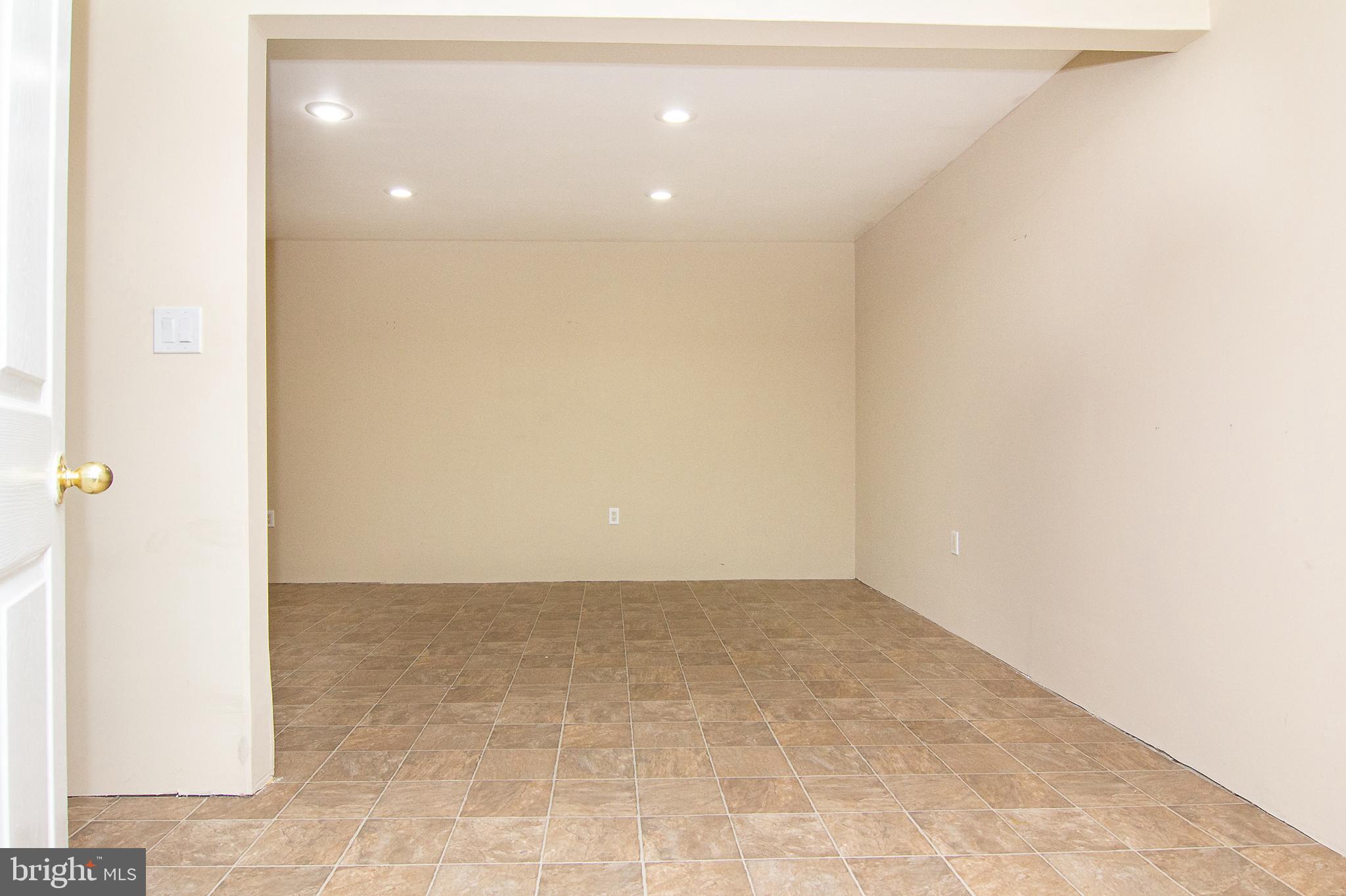 840 Century Street Hampstead, MD 21074 - Photo 17 of 34 an empty room with a hallway