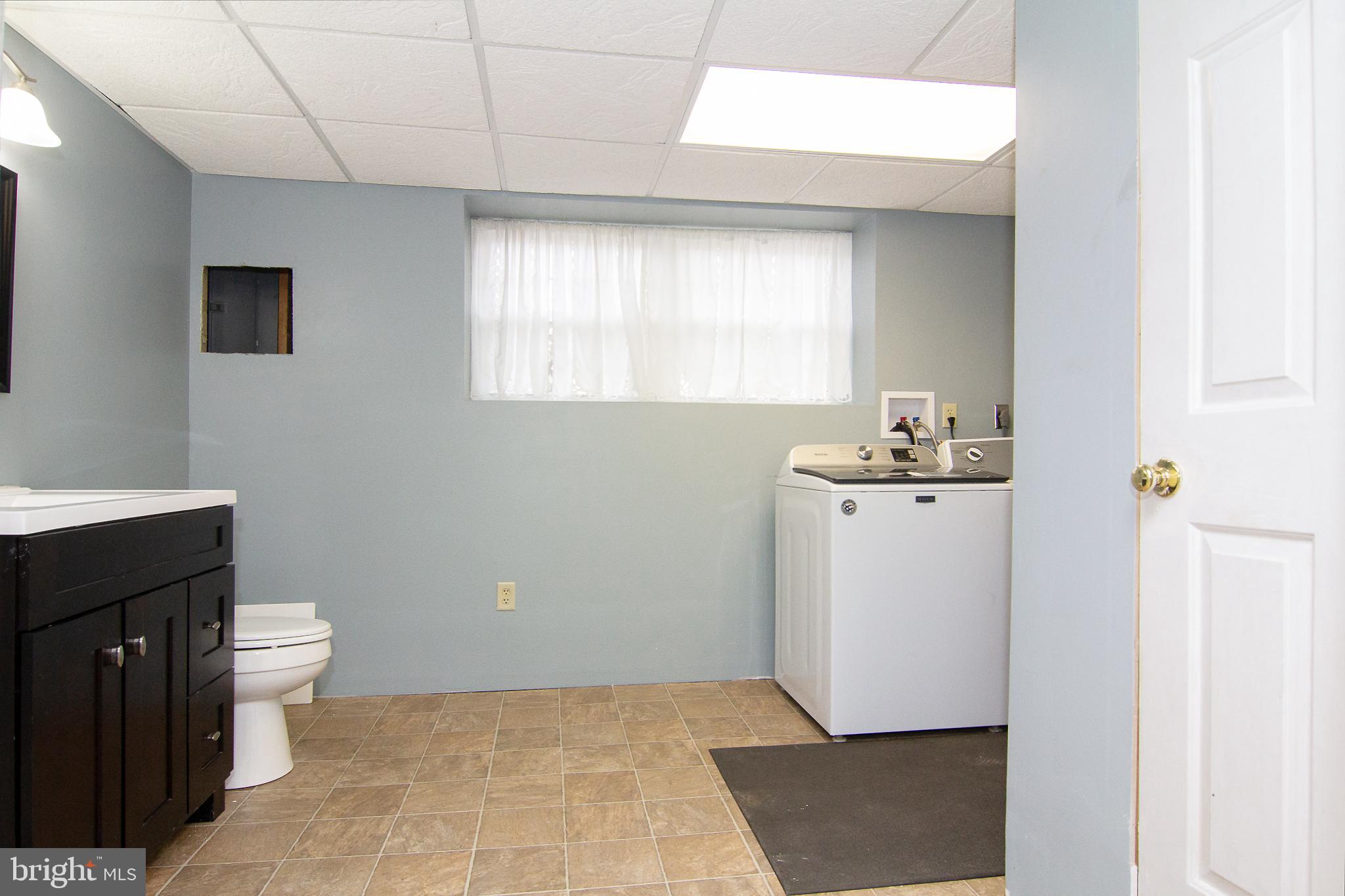 840 Century Street Hampstead, MD 21074 - Photo 18 of 34 a bathroom with a sink a toilet and a window