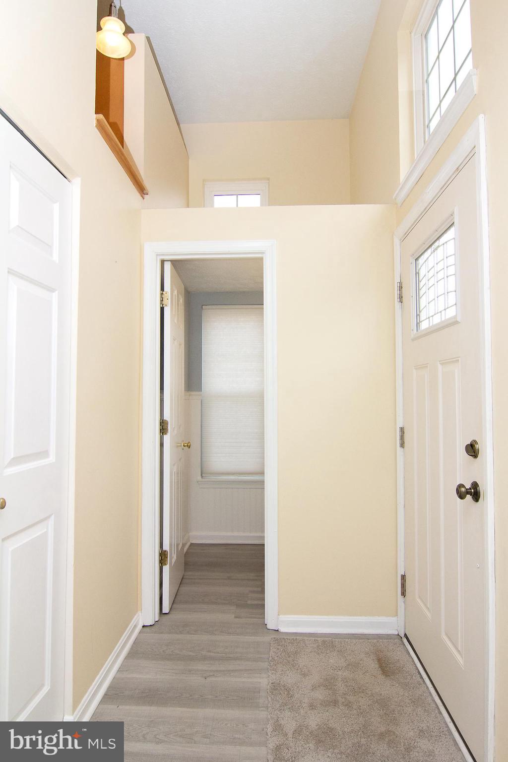 840 Century Street Hampstead, MD 21074 - Photo 2 of 34 a view of a hallway with wooden floor and closet