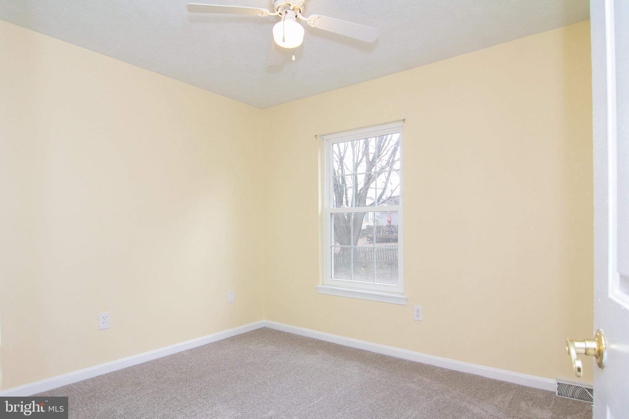 840 Century Street Hampstead, MD 21074 - Photo 25 of 34 an empty room with windows and fan