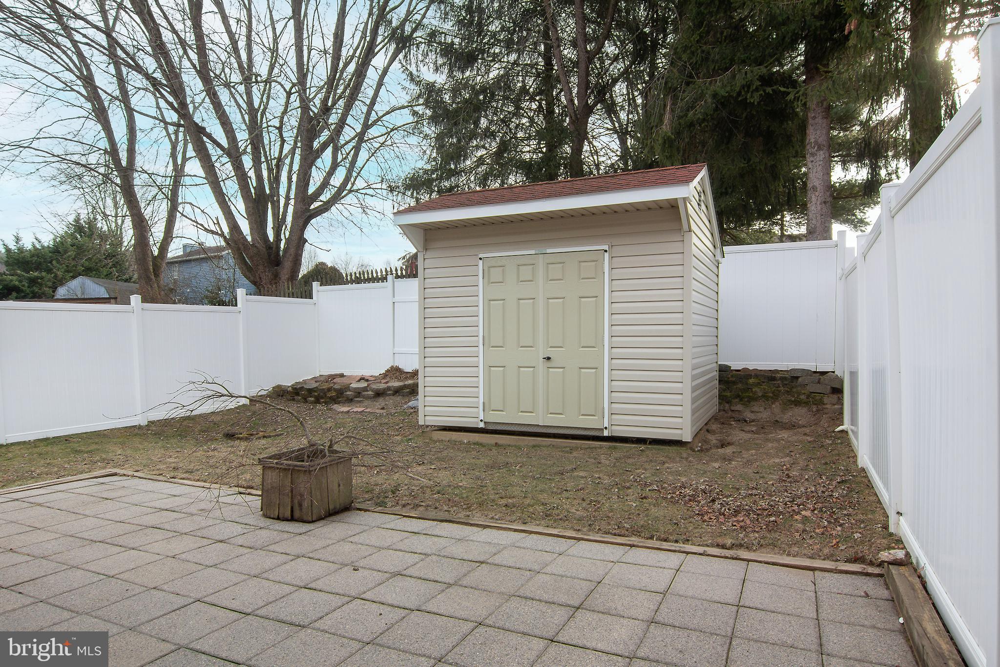 840 Century Street Hampstead, MD 21074 - Photo 27 of 34 a view of a house with a large tree and a yard