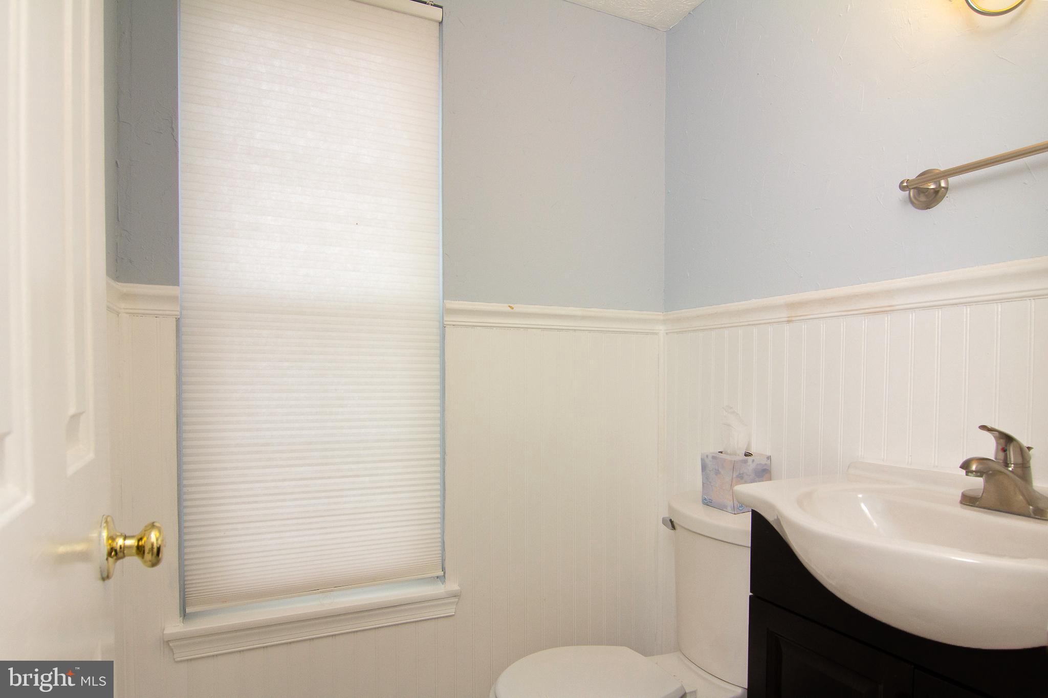 840 Century Street Hampstead, MD 21074 - Photo 3 of 34 a bathroom with a sink a toilet and shower