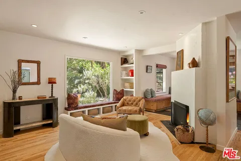 a outdoor living room with furniture and a window
