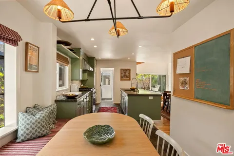 a kitchen with sink refrigerator and stove