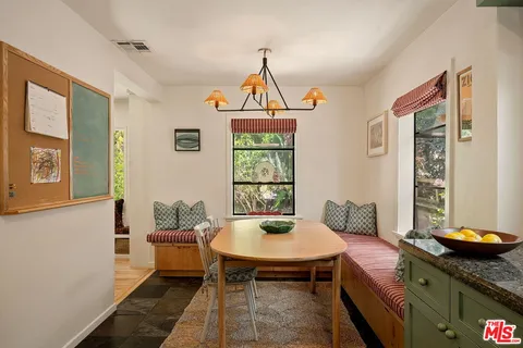 a kitchen that has a sink and a stove
