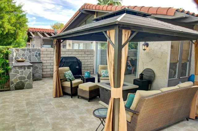 a view of living room filled with furniture and a table