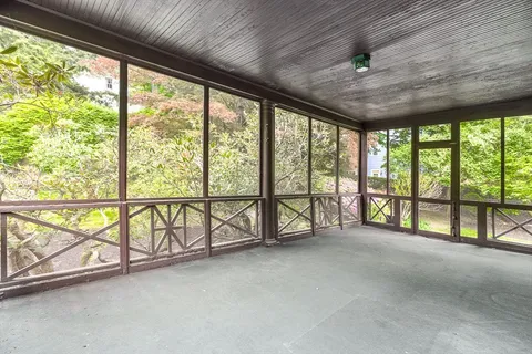 a view of an empty room with a large window