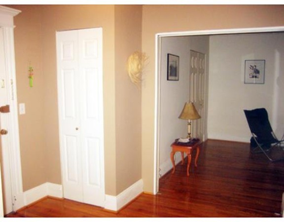 466 Commonwealth Avenue, Unit 506 Boston, MA 02215 - Photo 5 of 10 a view of a livingroom with wooden floor and furniture