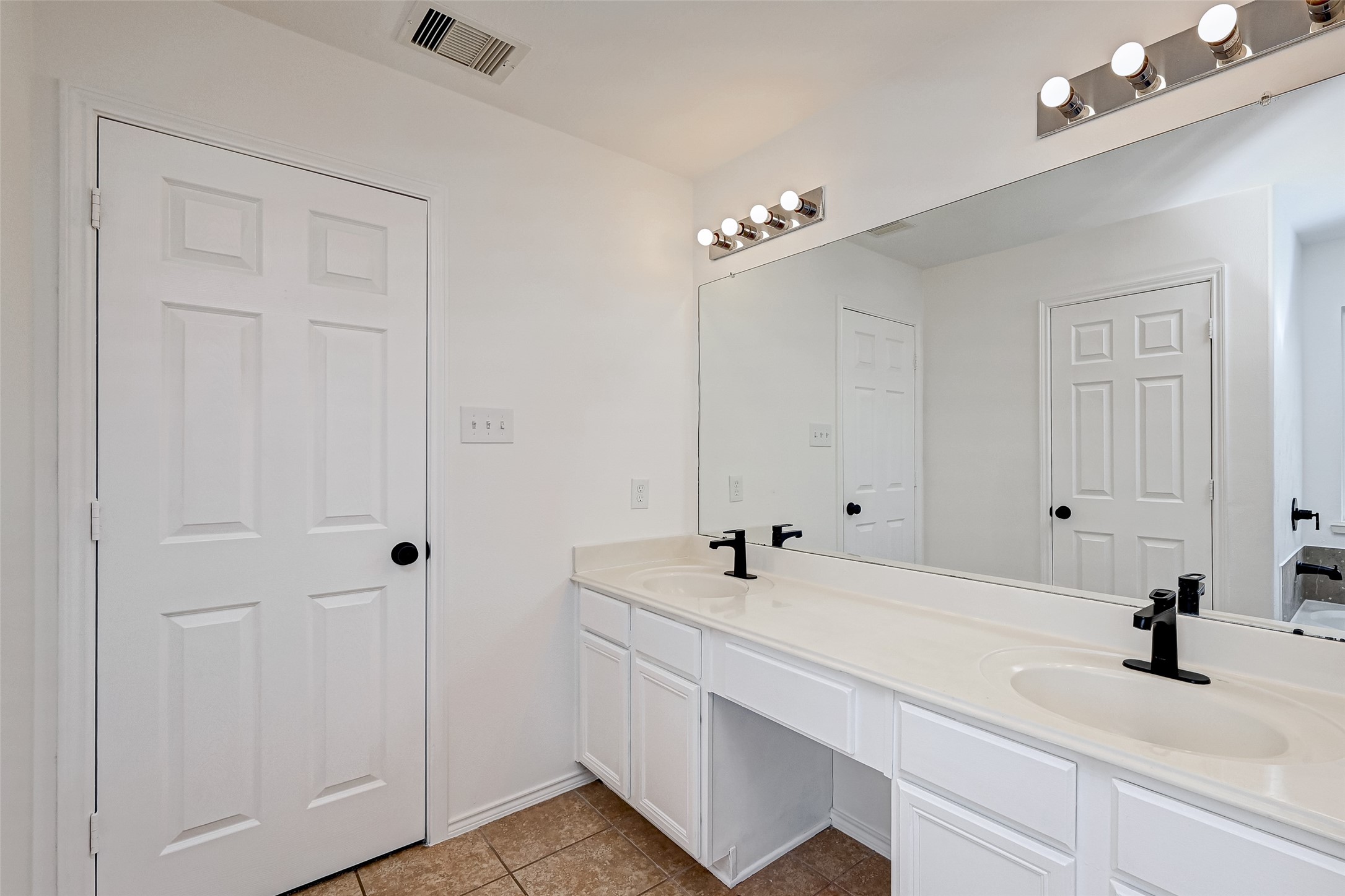 6906 Anson Point Lane Houston, TX 77040 - Photo 22 of 31 a bathroom with a sink and a mirror