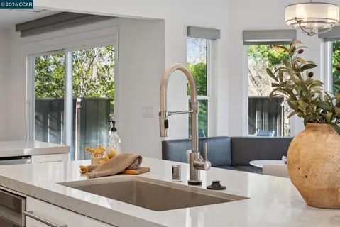 a bedroom with furniture and a lamp