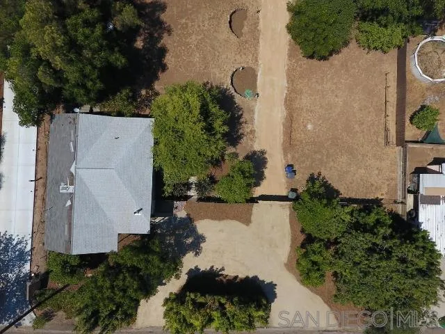 11832 Altadena Road Lakeside, CA 92040 - Photo 3 of 5 an aerial view of a house with a yard and garden