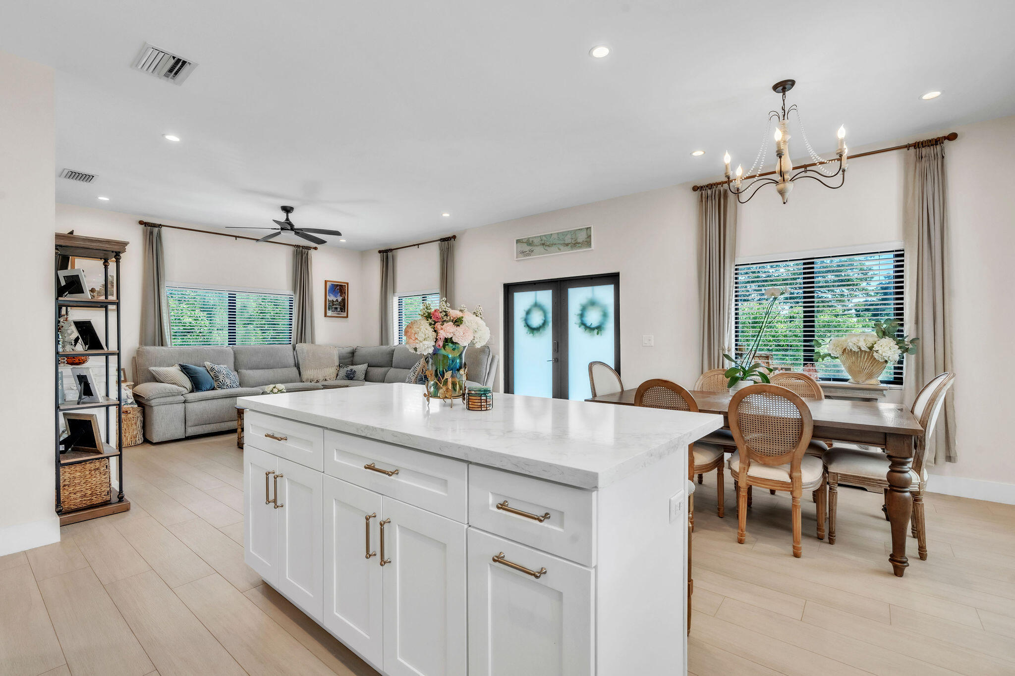 247 Hispanola Road Tavernier, FL 33070 - Photo 12 of 39 a large kitchen with kitchen island a island a sink and a large window