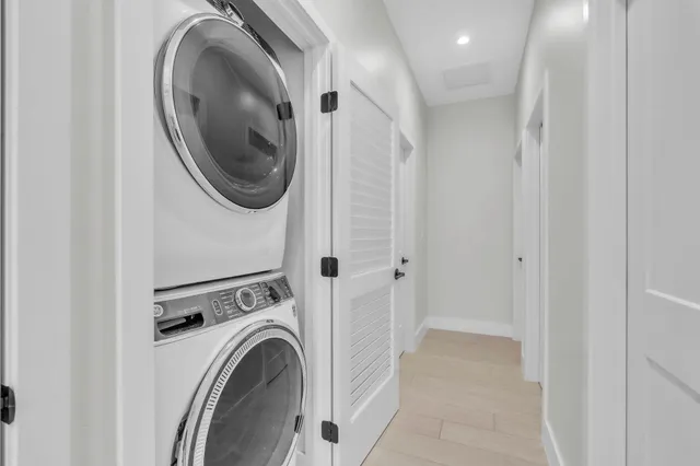 a view of a hallway with washer and dryer